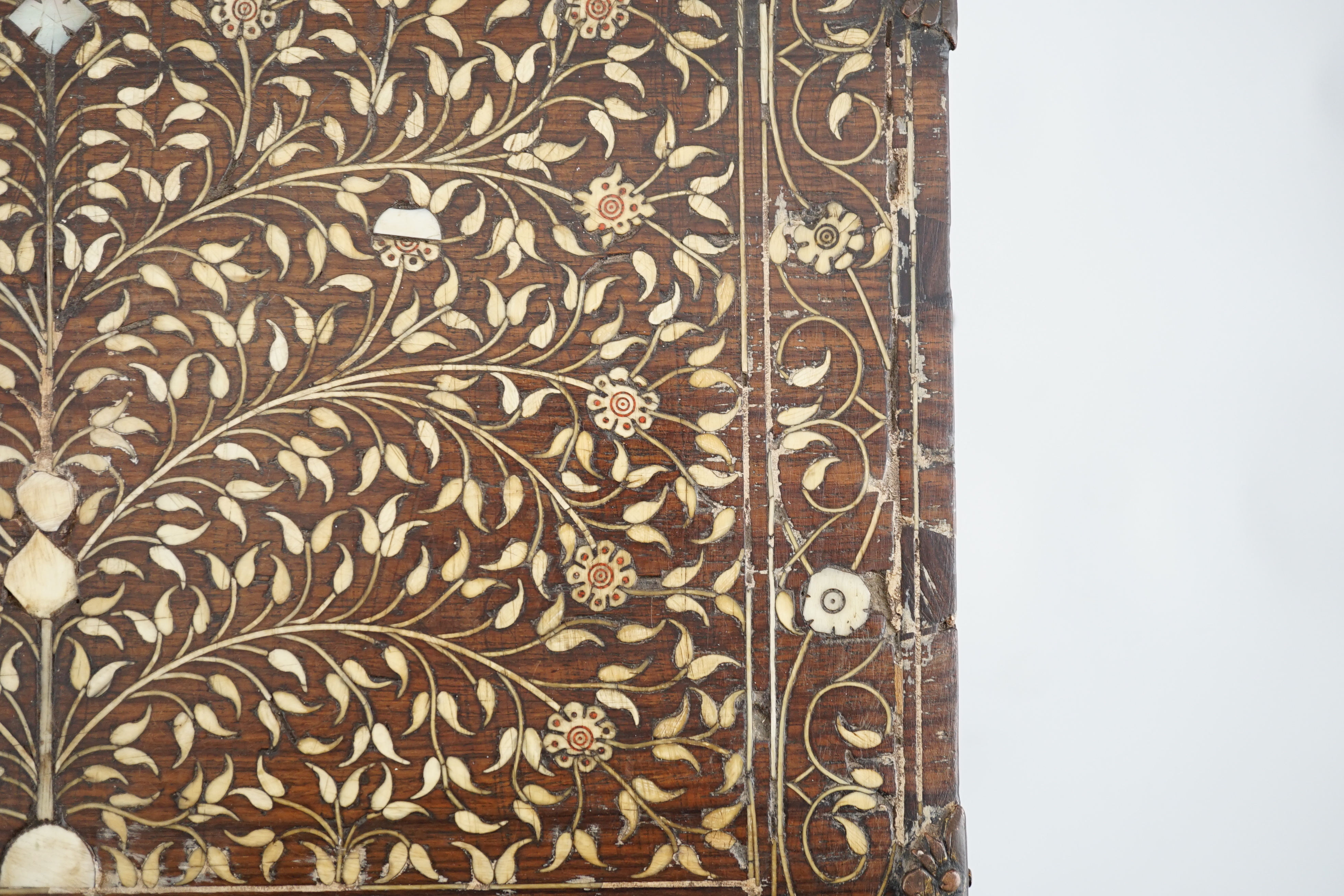 An early 17th century Indo-Portuguese ivory inset hardwood travelling chest